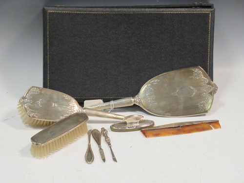 Lot 205 - A cased silver backed 4 piece dressing table...