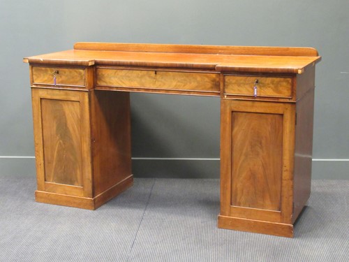 Lot 504 - A 19th century mahogany inverted breakfront...