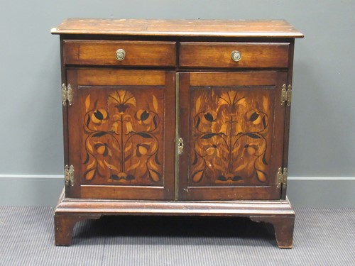 Lot 447 - An oak side cabinet with floral marquetry...