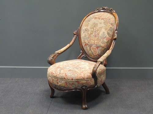 Lot 429 - A Victorian carved walnut elbow chair with...
