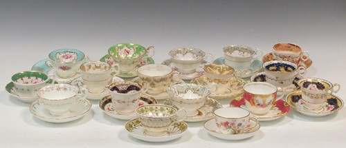 Lot 30 - A collection of English porcelain cups and...