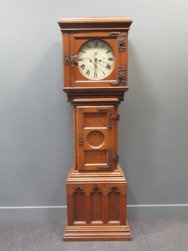 Lot 150 - A 19th century Gothic oak longcase clock with...