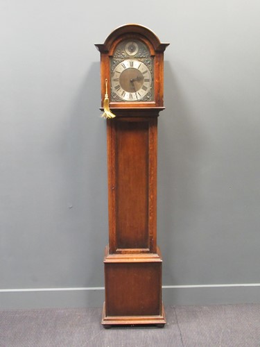 Lot 154 - A George III style oak longcase clock with...