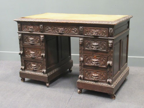 Lot 455 - A Victorian oak Jacobean style pedestal desk,...