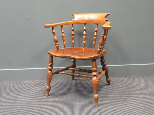 Lot 451 - A 19th century smokers bow armchair