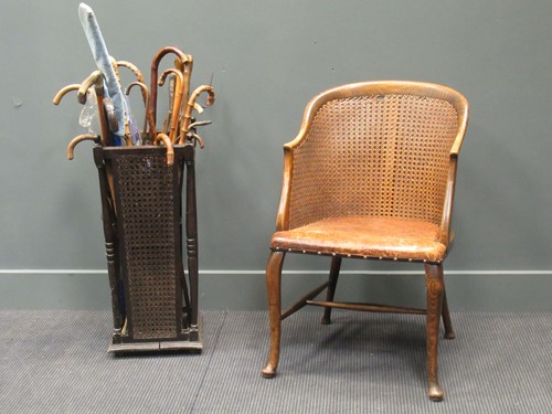Lot 432 - A cane-backed chair with a leather seat and a...