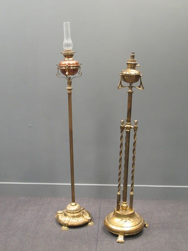 Lot 477 - Two Victorian brass standard oil lamps, 173cm...