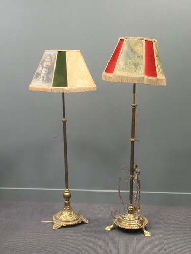 Lot 433 - Two Victorian brass adjustable standard lamps...