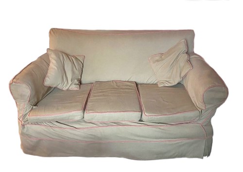 Lot 370 - A cream with pink piping upholstered...