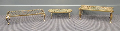 Lot 483 - Three George III and later brass trivets