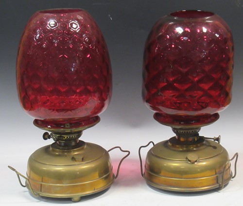 Lot 60 - A pair of brass two-handled oil lamps, with...