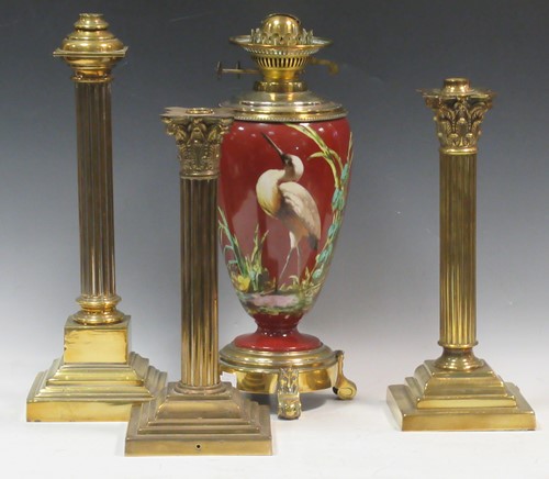 Lot 65 - A Victorian brass and porcelain oil lamp, the...