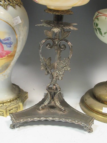 Lot 115 - Four Victorian oil lamps, 65cm tall, 63cm tall,...