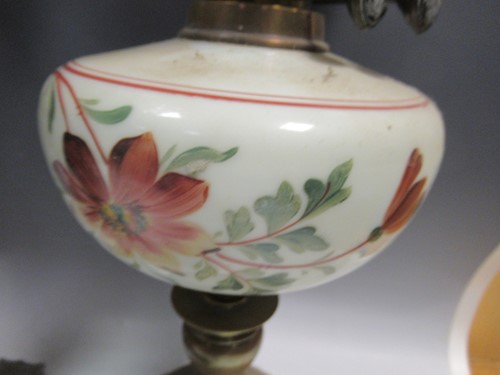 Lot 115 - Four Victorian oil lamps, 65cm tall, 63cm tall,...
