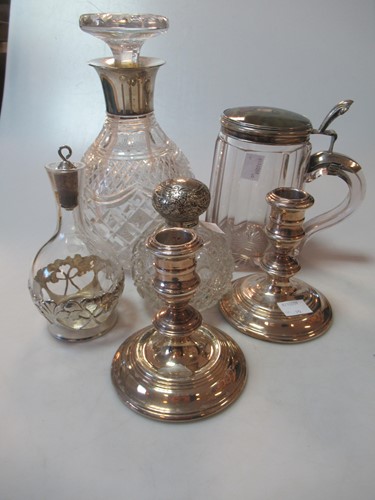 Lot 208 - A pair of loaded silver dwarf candlesticks,...