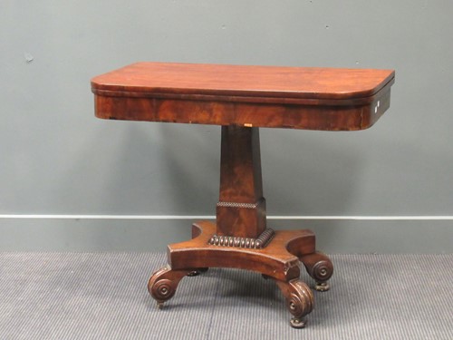 Lot 382 - A Regency mahogany fold over tea table, the...