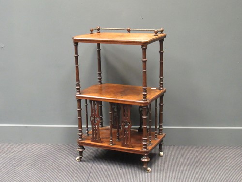 Lot 408 - A Victorian walnut three tier whatnot with...