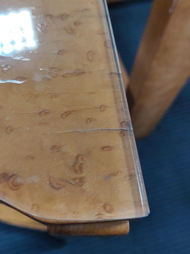 Lot 178 - An Art Deco birds eye maple nest of tables, in the manner of Epstein