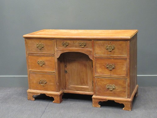 Lot 439 - A George III style pine kneehole desk, 19th...