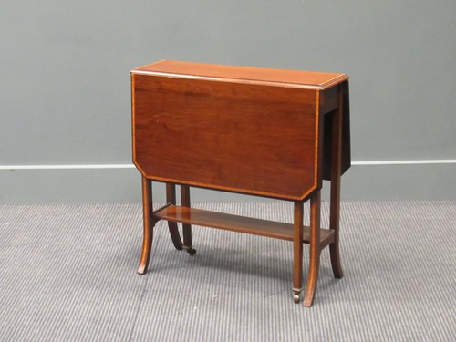 Lot 410 - A Waring and Gillows mahogany Sutherland table,...