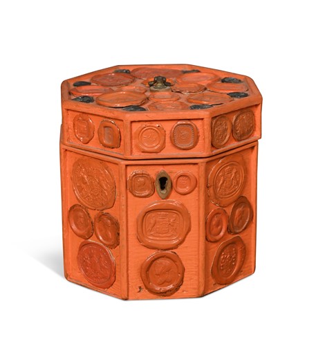 Lot 567 - A red and black wax seal applied tea caddy, 19/20th century