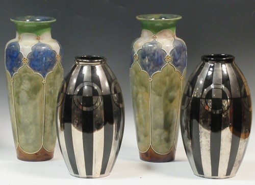Lot 31 - A pair of Doulton stoneware vases, 33cm high;...
