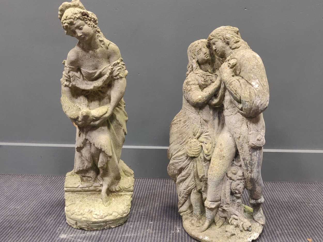 Lot 530 - A composite garden statue of a courting couple,...