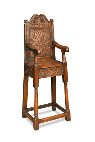 Lot 330 - A carved oak high chair, in the 17th century style