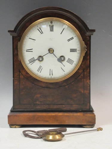 Lot 68 - A 19th century walnut-cased mantle clock with...