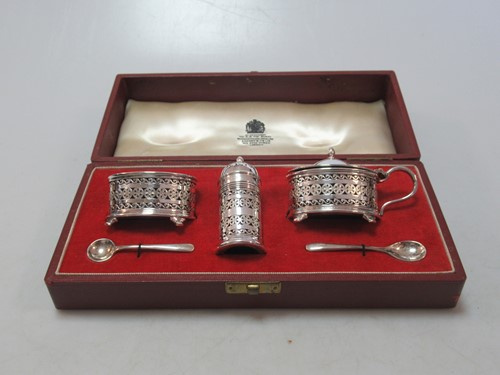 Lot 175 - A silver cruet set cased by Asprey, each main...