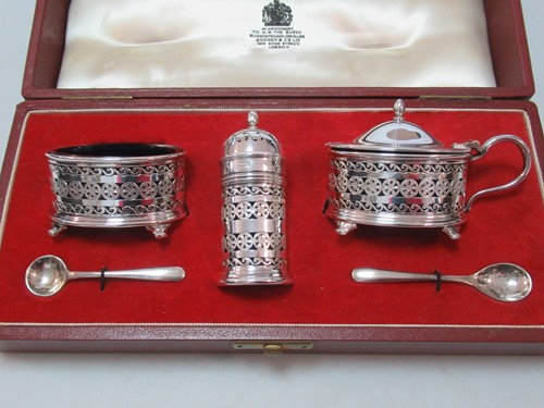 Lot 175 - A silver cruet set cased by Asprey, each main...