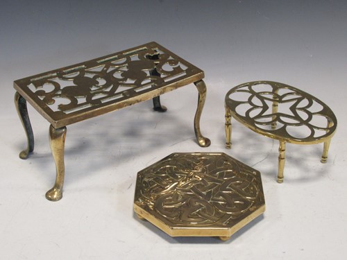 Lot 68 - Three brass trivets, to include an octagonal...