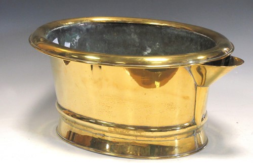 Lot 95 - A brass foot bath with pouring spout, 24 x 53...