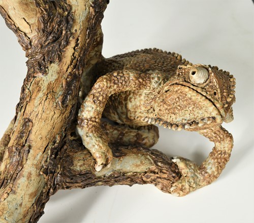 Lot 90 - David Cooke (1970-), a ceramic sculpture of a chameleon on a branch, 1996