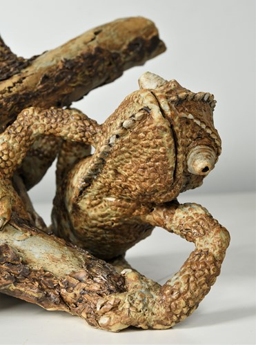 Lot 90 - David Cooke (1970-), a ceramic sculpture of a chameleon on a branch, 1996