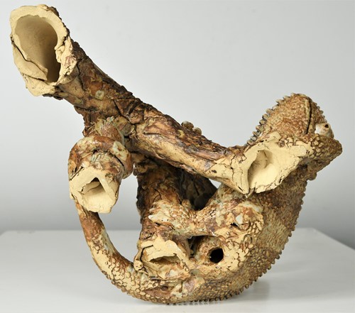 Lot 90 - David Cooke (1970-), a ceramic sculpture of a chameleon on a branch, 1996