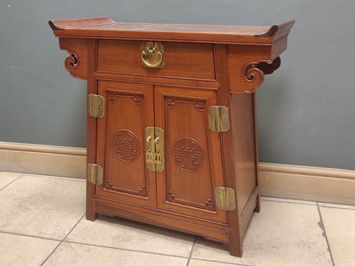 Lot 377 - A Chinese hardwood side cabinet, fitted with a...
