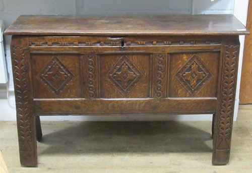 Lot 511 - An early 18th century oak coffer, the front...