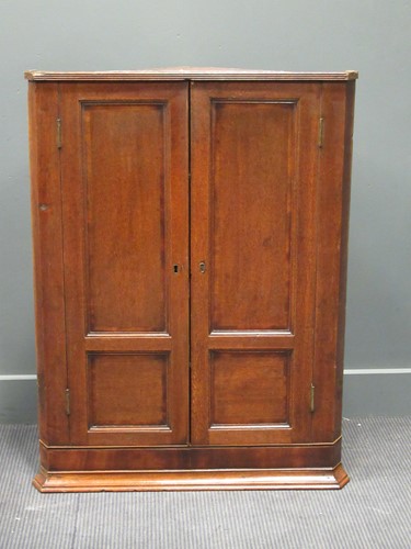 Lot 391 - A George III oak hanging corner cupboard, 106...