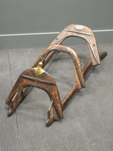 Lot 481 - An antique iron reinforced Mahawi (camel saddle)