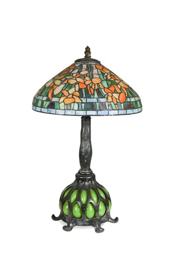 Lot 98 - A Tiffany style leaded glass and bronze table lamp