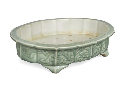 Lot 57 - An oriental celadon glazed shallow jardiniere, late Qing Dynasty, late 19th/early 20th century