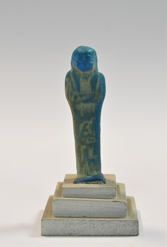 Lot 556 - A group of four Egyptian small bright blue shabti figures