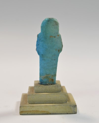 Lot 556 - A group of four Egyptian small bright blue shabti figures