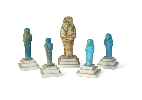 Lot 556 - A group of four Egyptian small bright blue shabti figures
