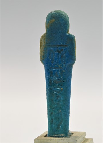 Lot 556 - A group of four Egyptian small bright blue shabti figures