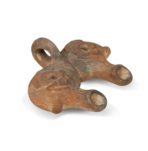 Lot 550 - A rare Roman-Egyptian pottery double spout oil lamp