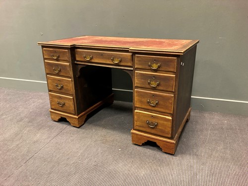 Lot 453 - A Georgian style mahogany inverted breakfront...