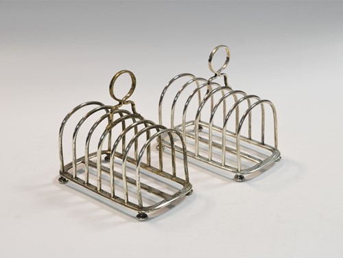 Lot 554 - A pair of Victorian silver 7 bar toast racks