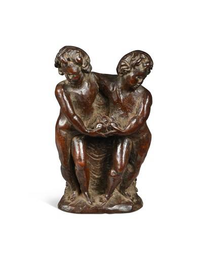Lot 337 - A carved walnut small figure group of two standing Putti,  perhaps Flemish 17th century